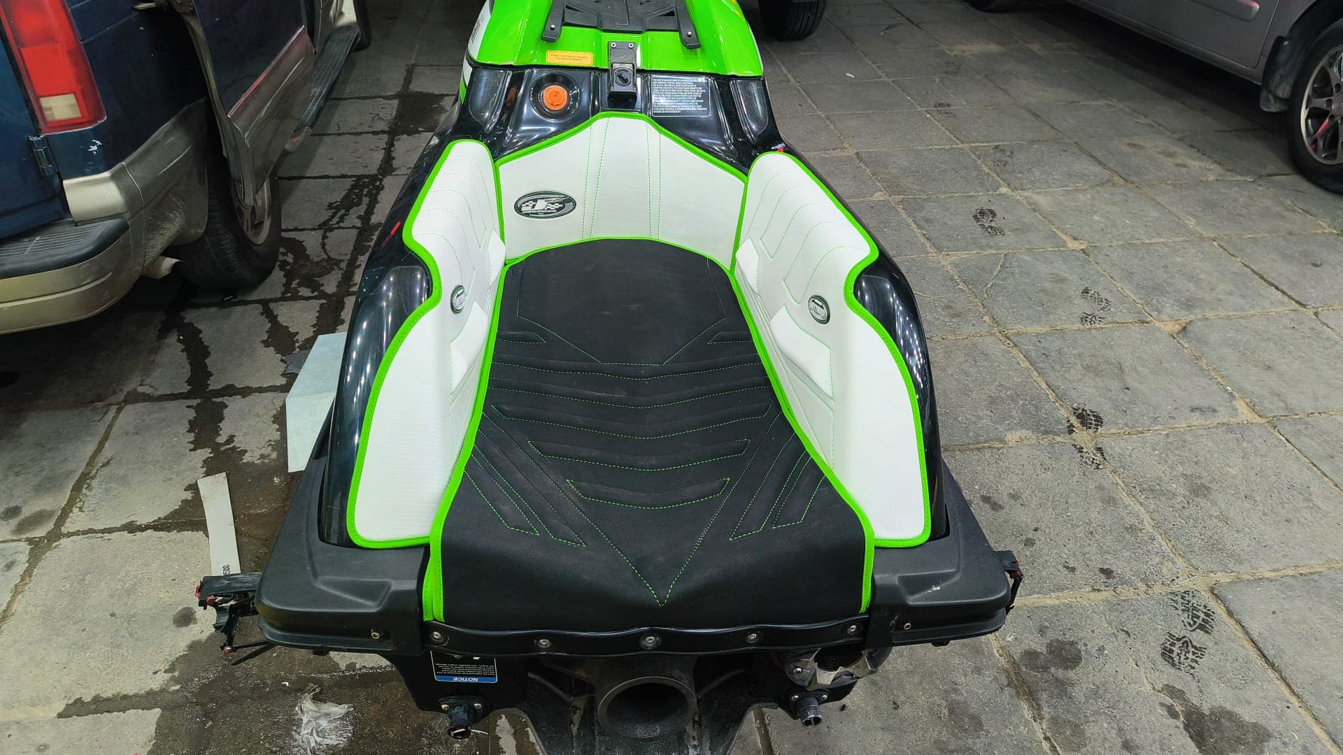 Finished green and white custom jet ski seat with tailored marine upholstery by Shakeel Marine in Kuwait
